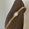 Stylish design, sophisticated oval-shaped women's watch, light luxury gold, exquisite quartz watch, elegant ladies' wristwatch.