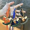 Creative leather rocking horse keychain cute trendy cool PU Trojan horse pendant men and women versatile bag hanging accessories small gifts