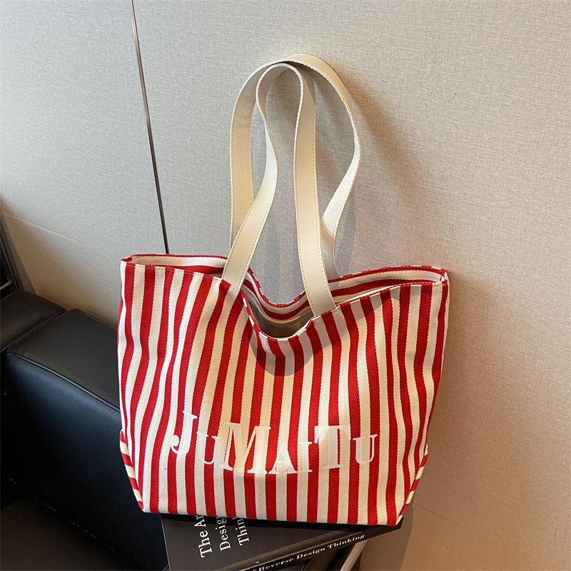 Niche design fashionable striped tote bag women's new large-capacity lazy wind shoulder bag canvas bag