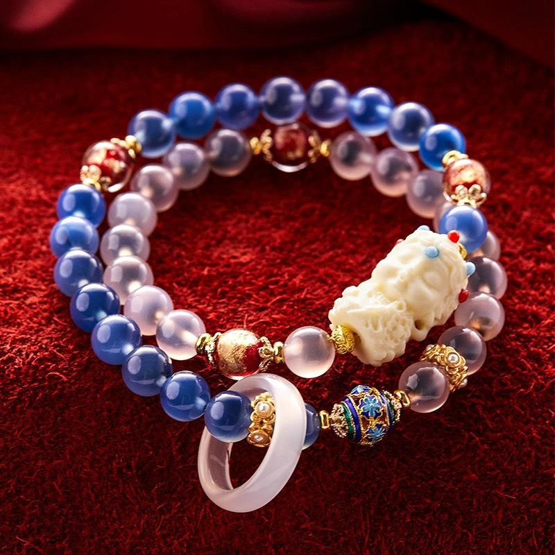

Tara Multi-Treasure Gold Foil Agate Glass Bead Bracelet with Swallowing Beast Charm