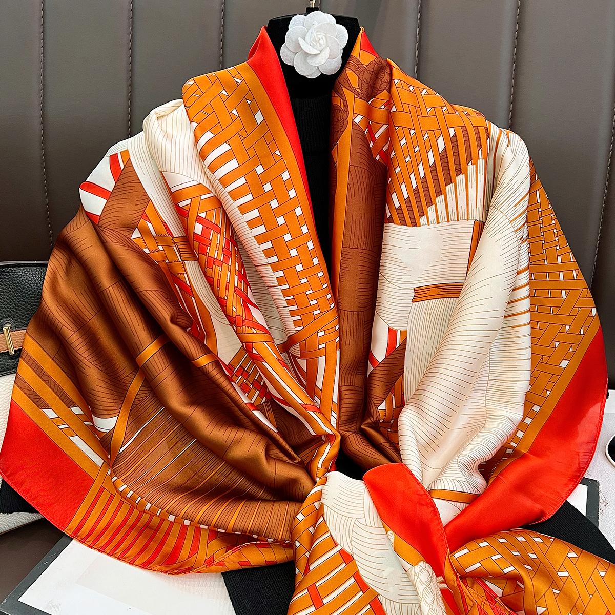 

The new orange double horse head long silk scarf has a white fashion temperament and a shawl for mothers and elders. 180cm