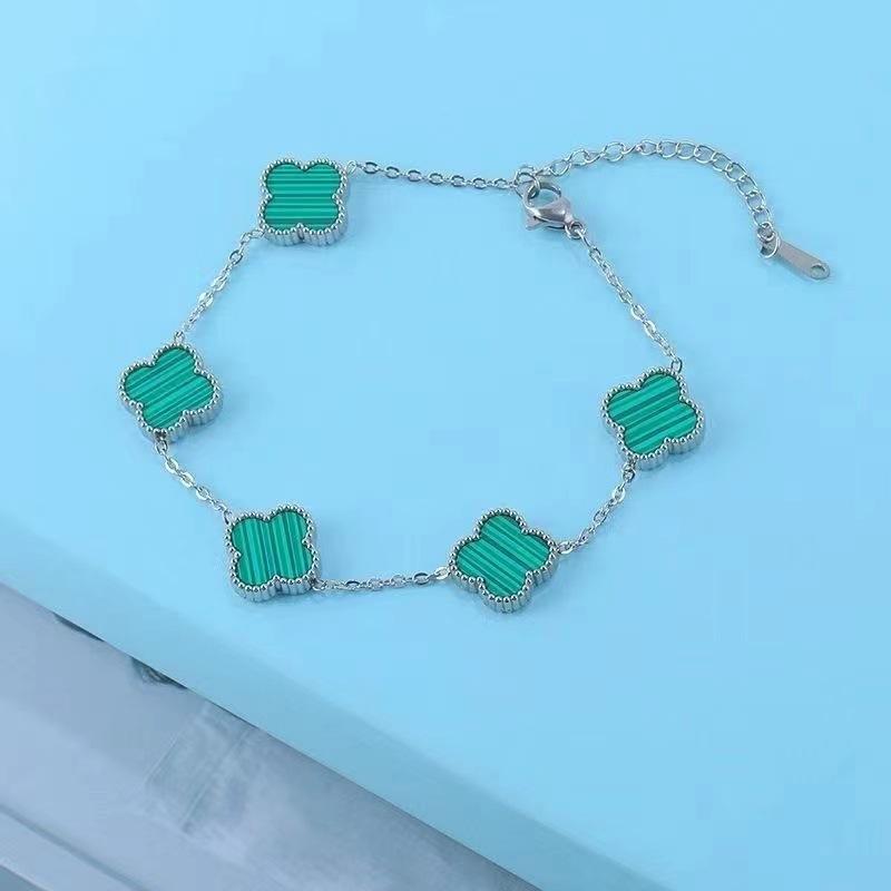 Bracciale da donna a fascia con conchiglia double-face e quadrifoglio, resistente ai colori, alla moda e di alta gamma