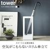 Slim, thin, Scandinavian-inspired umbrella stand for entryways. Tower design, simple, available in white and black. Yamazaki Industries (white).