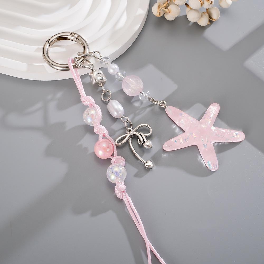 Handmade beaded woven rope pendant with colorful sequins and star-shaped design for mobile phone decoration.