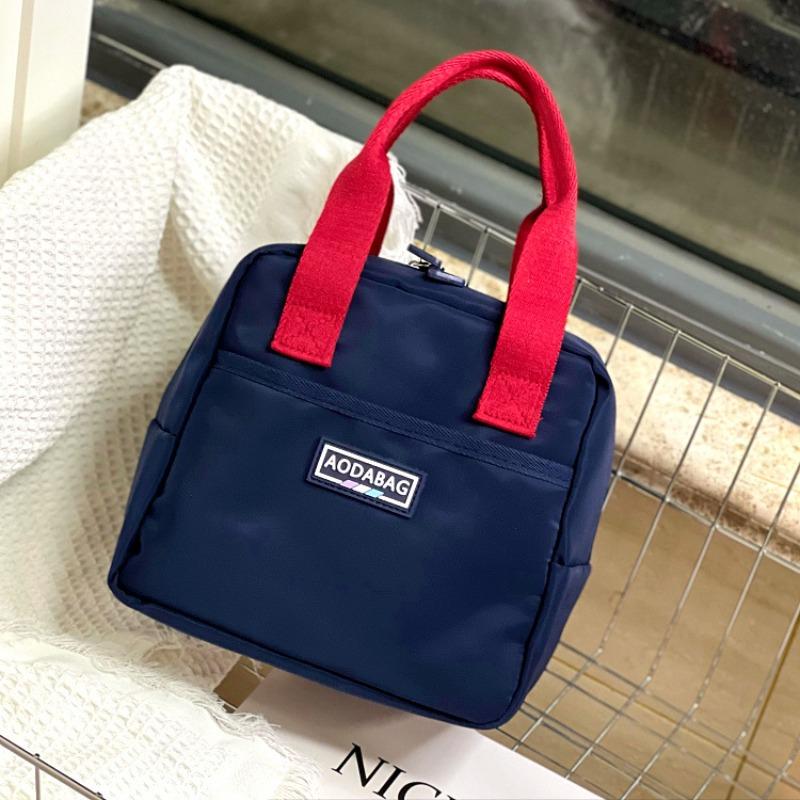 

New niche contrasting color anti-splashing portable lunch box bag to work hand carry snacks sundries bag women s bag