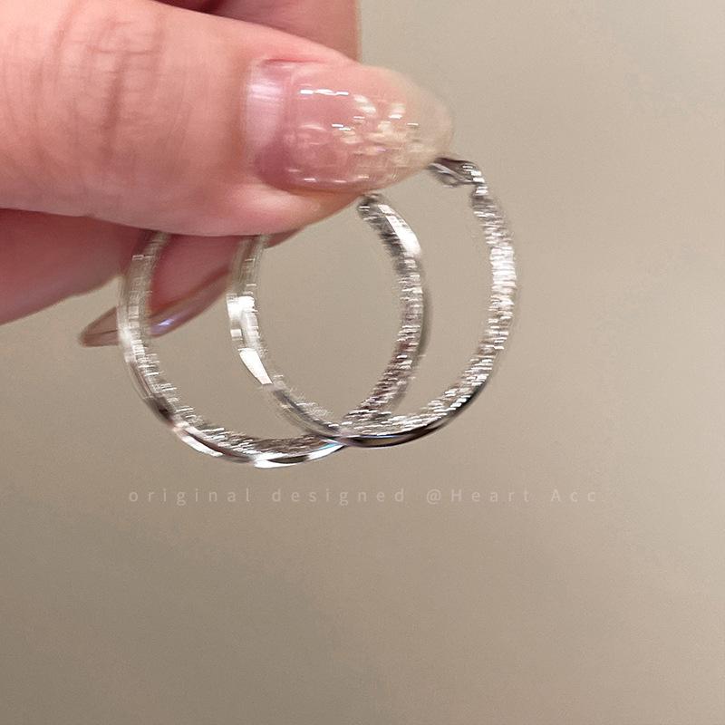 Elegant Silver Hoop Earrings with Unique Design for Women