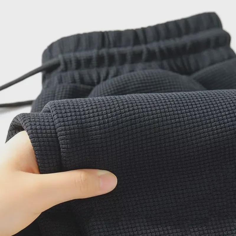 Pánské velké trendy sportovní kalhoty se stahovací šňůrkou - 2024 ležérní volný střih