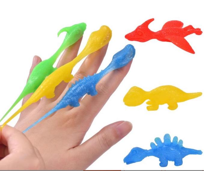 Игрушка-катапульта с пальцевыми дротиками  Динозавр  - Мягкая резиновая забава для детей