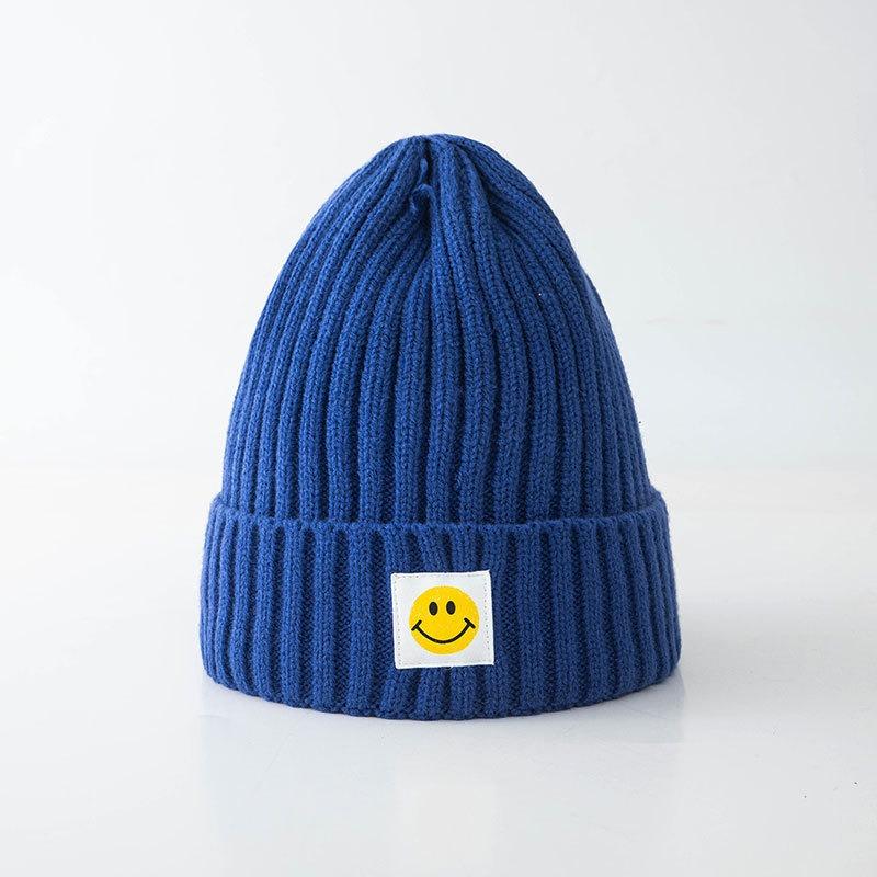 Smiley face label wool hat female autumn and winter warm bag head couple trendy brand cold hat solid color student male knitted hat