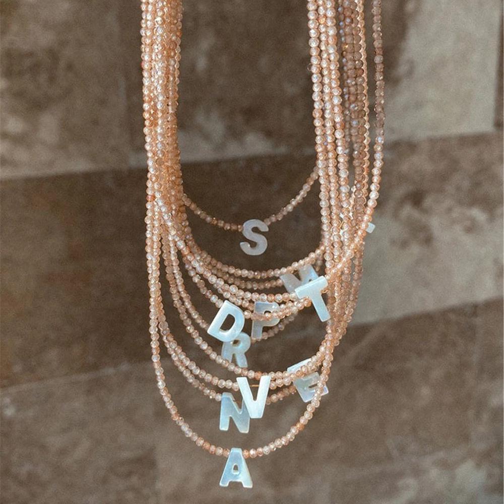 Elegant 2m Zircon Beaded Clavicle Chain: 26-Letter Deep Sea Shell Necklace for Women.