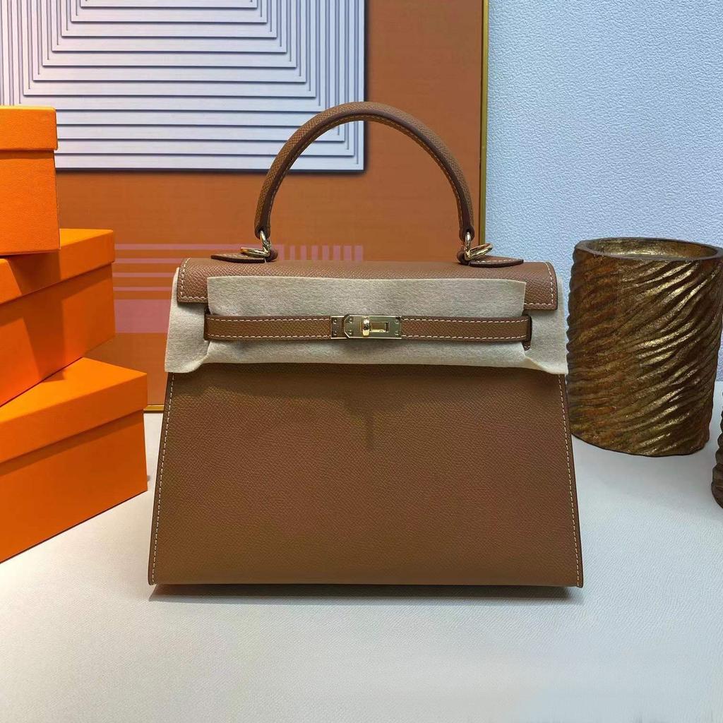 Grenzüberschreitende Hersteller Großhandel Damenhandtaschen 2023 neue Handtaschen aus Leder mit Palmenmuster tragbare Schulter-Umhängetaschen Damenhandtaschen große Kapazität