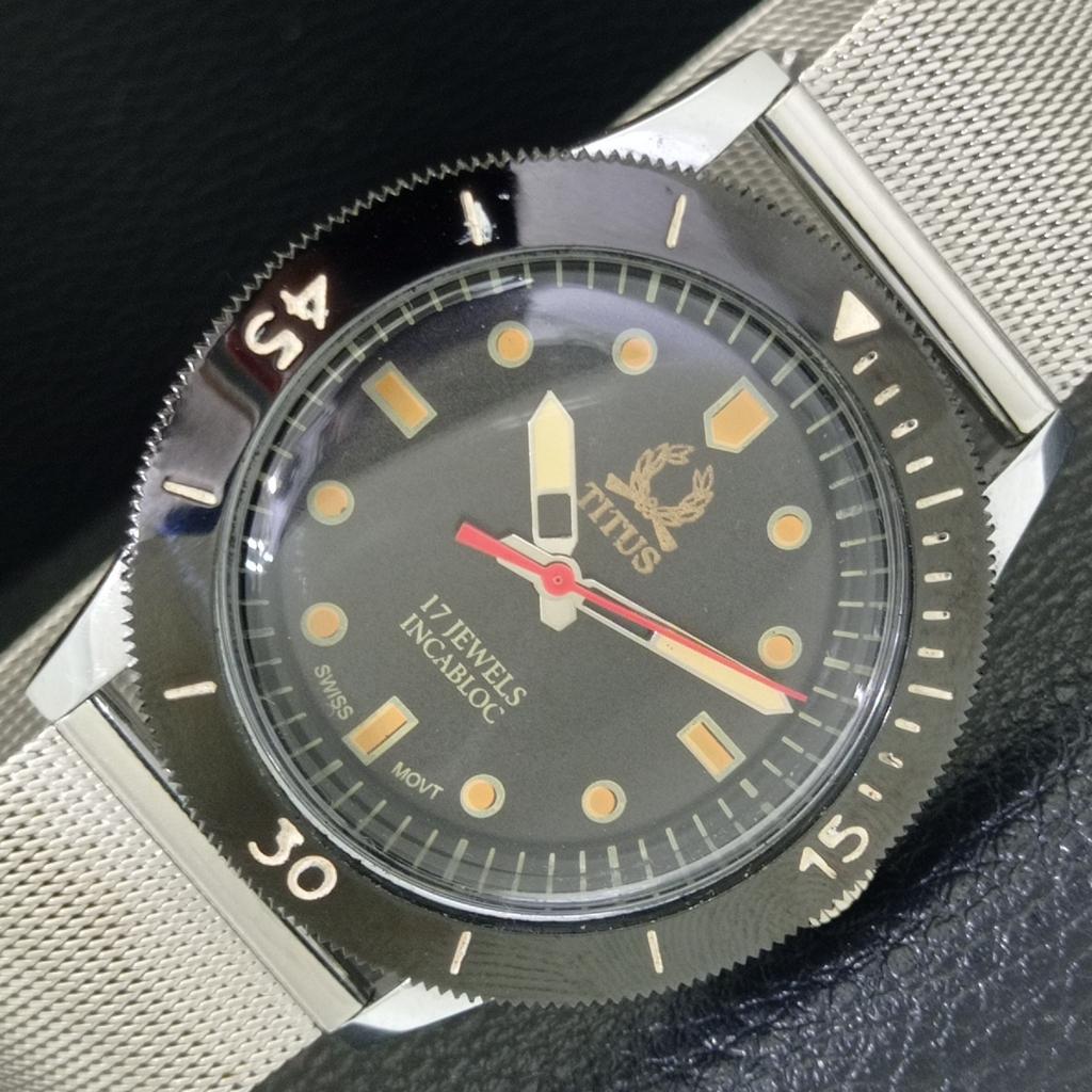 

ШВЕЙЦАРСКИЕ ВИНТАЖНЫЕ ЧАСЫ TITUS С РУЧНЫМ ЗАВОДОМ, ВРАЩАЮЩИМСЯ БЕЗЕЛЕМ, ЧЕРНЫМ ЦИФЕРБЛАТОМ a700262-5 R202-a700262