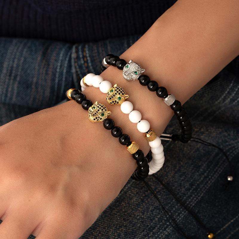 Men's Punk Braided Titanium Steel Bracelet with Leopard Head, Zircon, and Pineapple Beads.