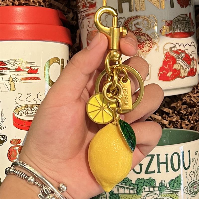 2025 Portachiavi Limone Dorato Ciondolo Borsa Portachiavi alla Moda Personalizzato Ciondolo Borsa Portachiavi Accessori Catena Borsa