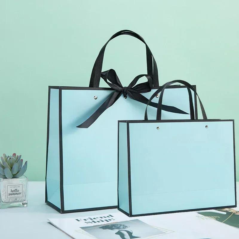 White Paper Jam Handbag Kraft Paper Thick Waterproof Frame Rivet Handle Gift Bag Cosmetic Clothing Store Portable Packaging Bags