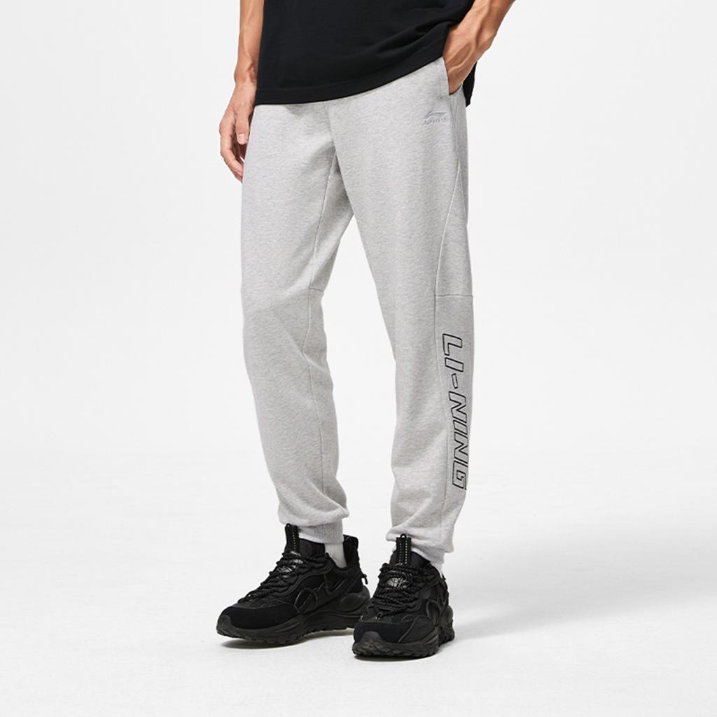 Li Ning Sports Lifestyle Series Letter Logo Printed Cuffed Knit Joggers Men Joggers Light-Mixed-Yellow Flower-Gray AKLU953-2