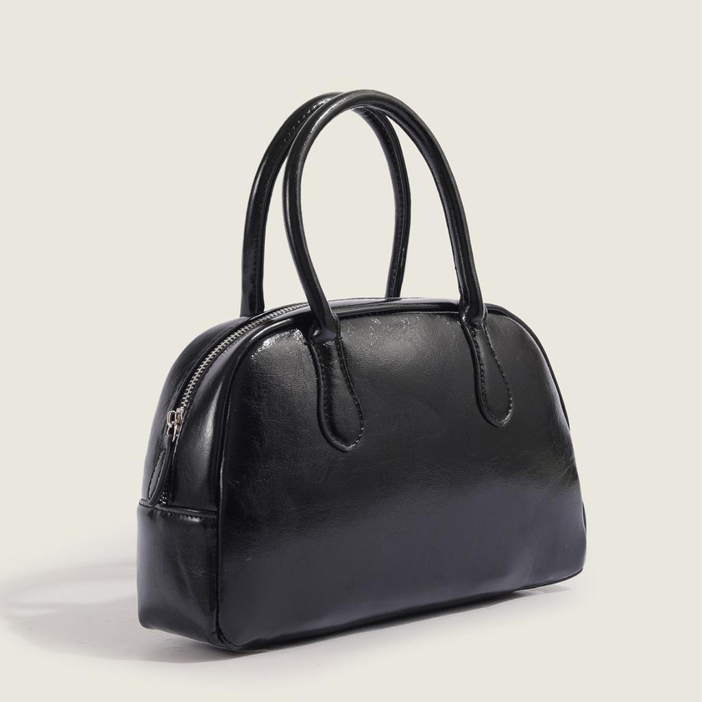 2025 Neue Koreanische Dongdaemun Nischen Handgehaltene Kissen Tasche für Damen Einfache Textur Pendler Handgehaltene Boston Tasche