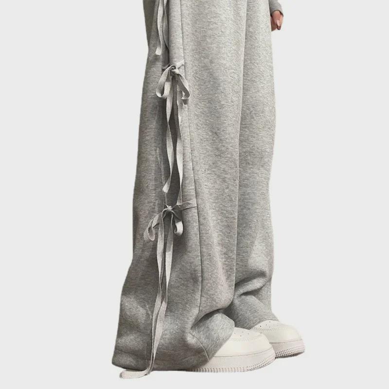 Skladem Dámské šedé sportovní kalhoty se širokými nohavicemi a mašlí - Nový design pro jaro/podzim 2024