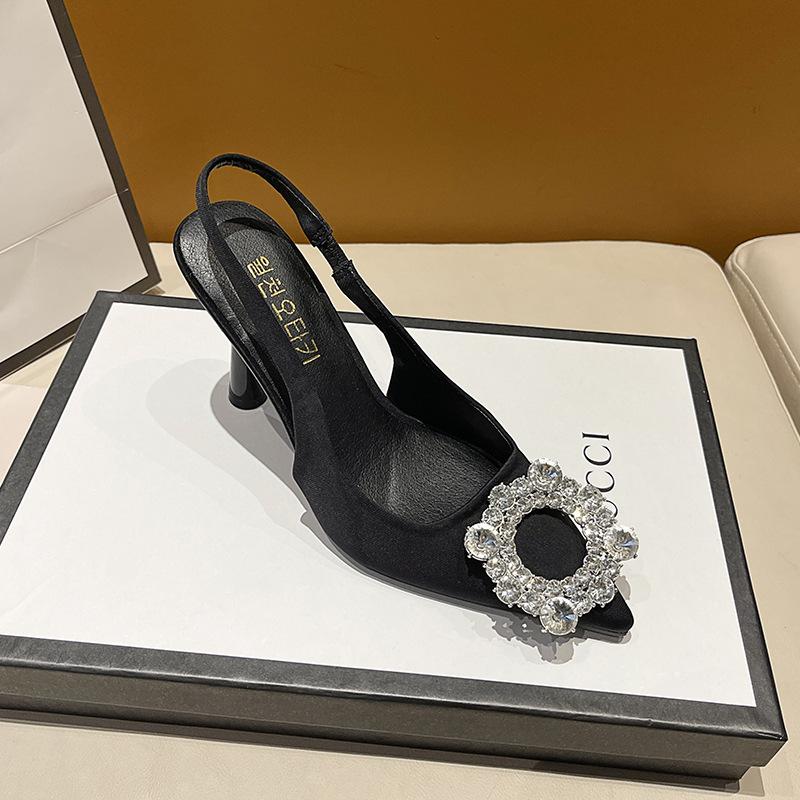 Black pointed high-heeled single shoes women's buckle rhinestones spring and summer new versatile side empty stiletto with skirt
