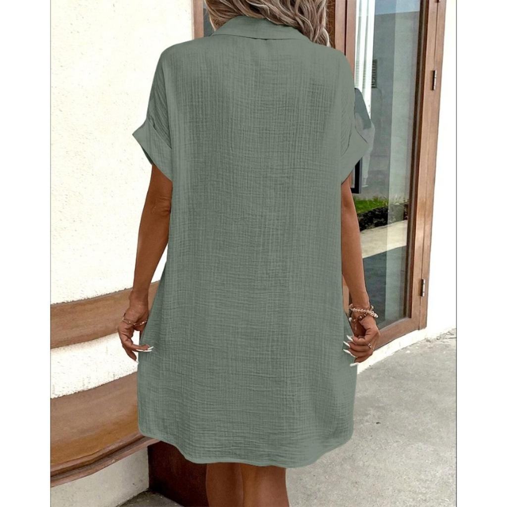 A Simple White Shirt Skirt, Made of Breathable Cotton, with A Streamlined Collar Design and Orderly Button Arrangement, Adding A Vintage Charm