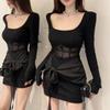 Sexy hot girl with a loose collarbone-length mesh little black dress with a slimming slimming and trendy hip-hugging dress