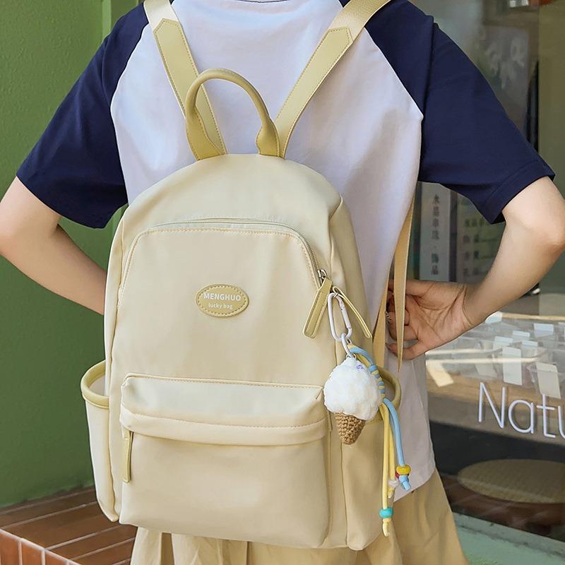Fresh and sweet candy color backpack for junior high school students, solid color, simple and large-capacity backpack.