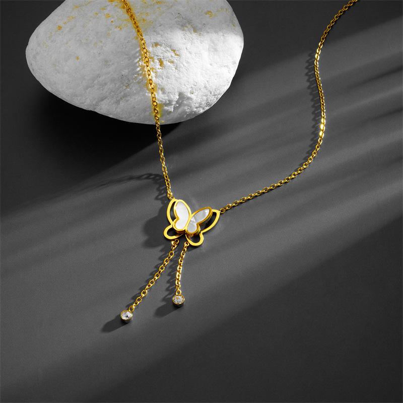 Stylish Titanium Steel Women's Necklace: Double-Layer White Shell with Rhinestone Butterfly Tassel, Hollow Design Collarbone Chain.