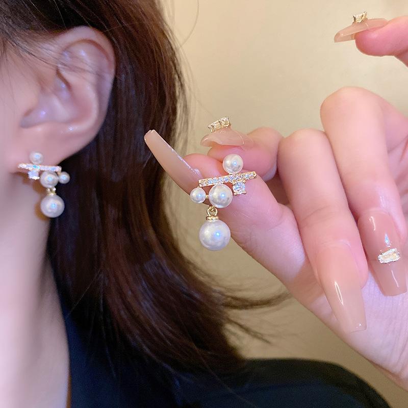 Silver needle micro-inlaid zircon pearl earrings women's light luxury high-end sense niche unique earrings Japanese and Korean style ear jewelry