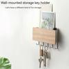 Wandmontierter Schlüsselhalter für die Eingangshalle ohne Stanzhaken. Multifunktionaler Holz-Schuttlagerständer hinter der Tür