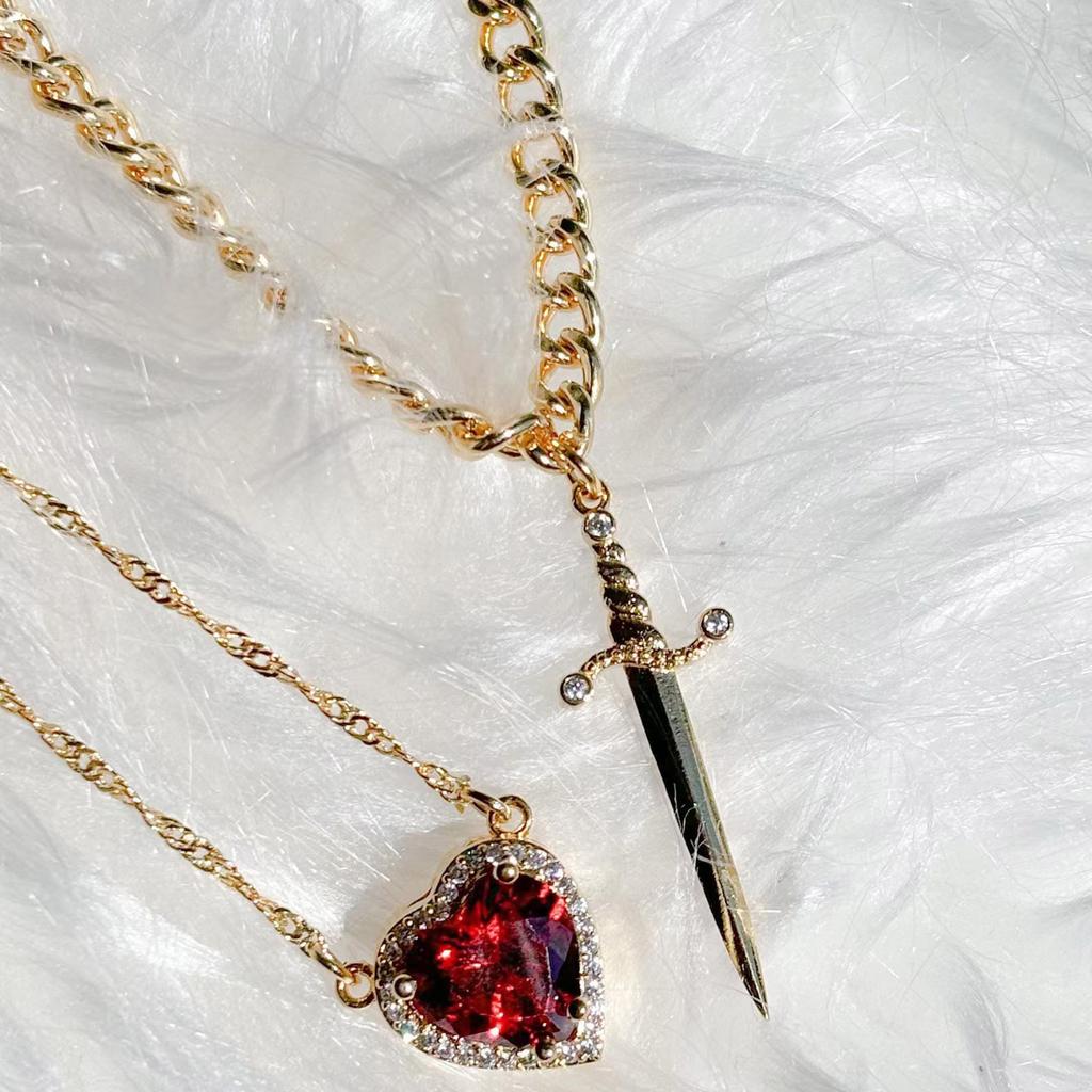 Elegant Heart Dagger Designs Necklace Charming Heart Dagger Necklace with Crystal Highlights for Special Occasions