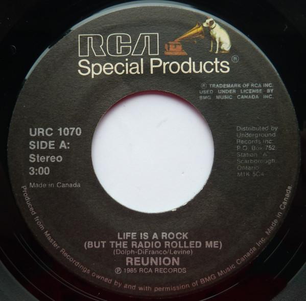 

7inch Record REUNION / FOUR JACKS & A JILL - Life Is A Rock (But The Radio Rolle URC1070 RCA Victor 1985 Canada Rock Used