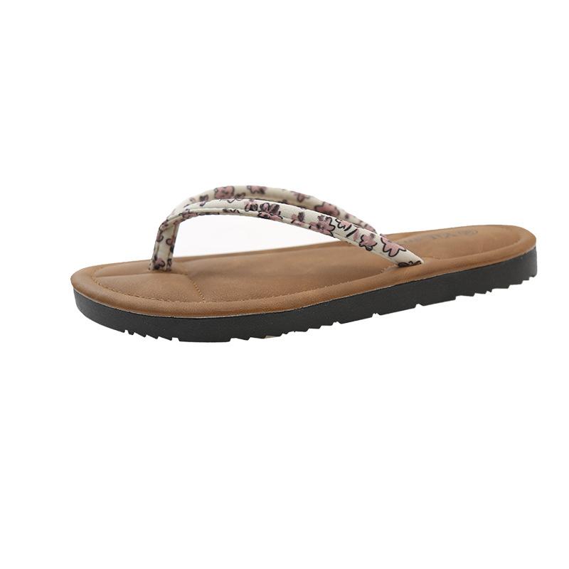 

Flat bottom pinch beach slippers women s 2025 summer wear new fashionable small floral herringbone cool slippers foreign trade large size 35