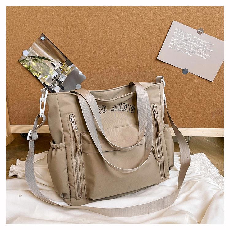 

2024 Women s Large Capacity Lightweight Japanese Style Crossbody Bag - Multifunctional Casual Travel Bag for College Students хакі