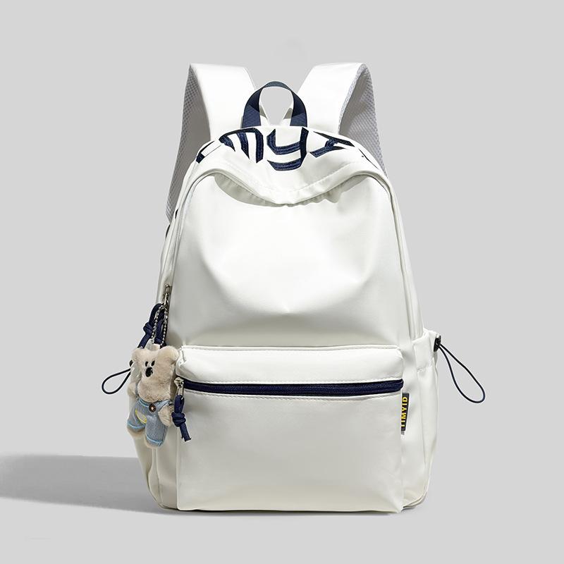 Schoolbag Japanese simple and versatile large-capacity solid color campus schoolbag 1011 summer new light commuter student backpack