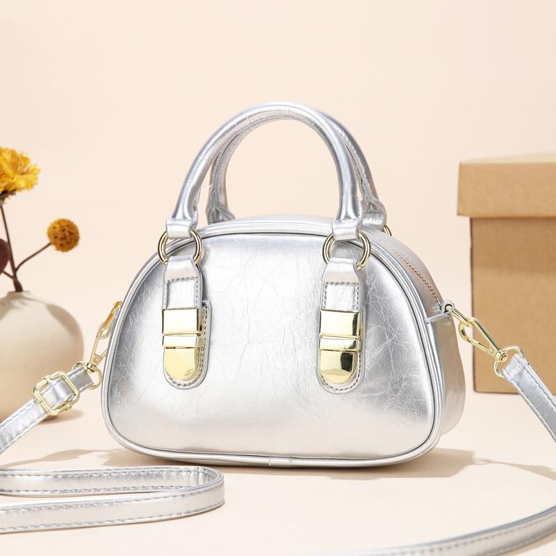 Spacious Elegant And Shoulder Bag For Women With Unique Shell Shape And Durable Lining Polyester