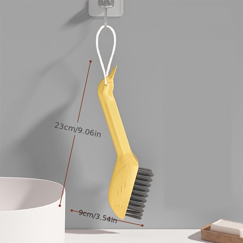 

A Multifunctional Gap Cleaning Brush in a Cartoon Swan Design, Featuring a Head on The Handle That Can Be Used As a Spatula to Remove Stubborn Stains жовтий