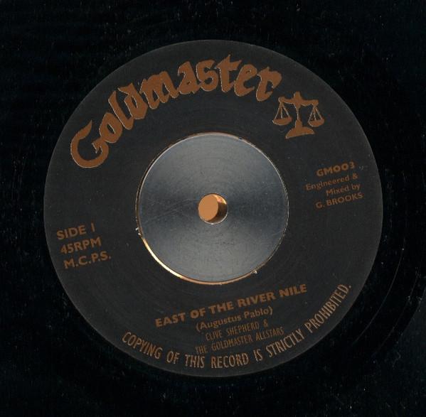

7-дюймовая пластинка CLIVE SHEPHERD GOLDMASTER ALLSTAR East Of The River Nile GM003 Goldmaster 1999 Великобритания Регги Ска Даб Б/у