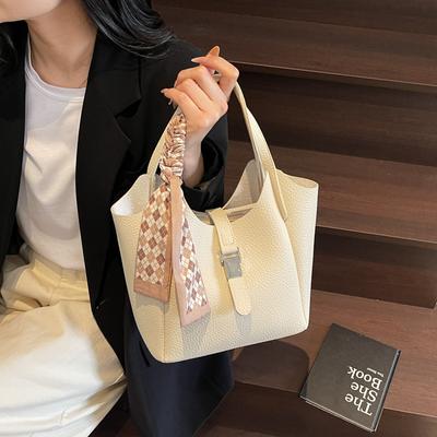 Europäische und koreanische Mode einfache tragbare Eimertasche mit großem Fassungsvermögen Frühling und Sommer neues Temperament Litschi-Muster Schulter-Umhängetasche