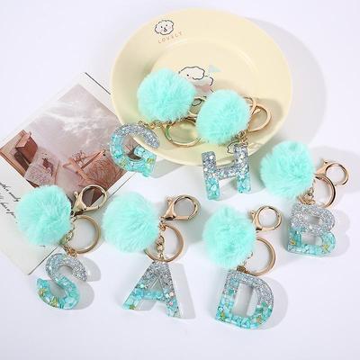 Lake Blue Resin Alphabet Keychain with Fur Ball Charm