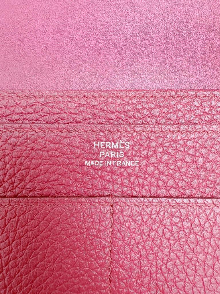 Použitá dlouhá peněženka Hermès Dogon GM v barvě vínová rubínová, stříbrné kování