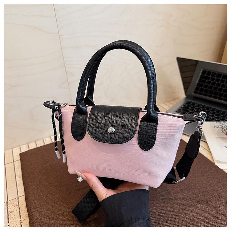 Minimalist Color-Block Oxford Cloth Handbag: Versatile, Fashionable Shoulder Bag with Unique Texture.