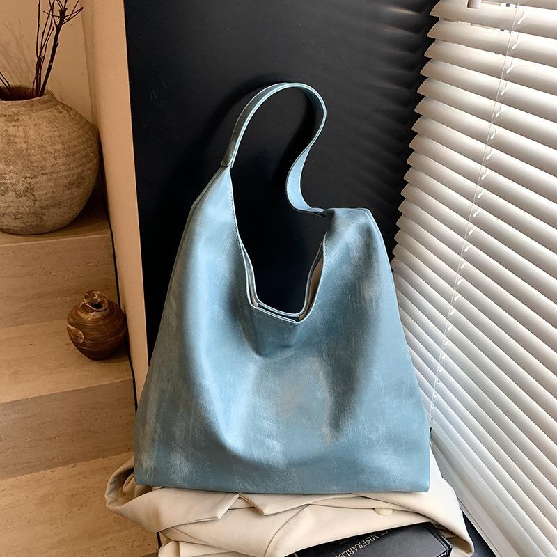 

Tote bag women s fashion hand carry large capacity shoulder mother and child bag summer new high-end underarm bag синій