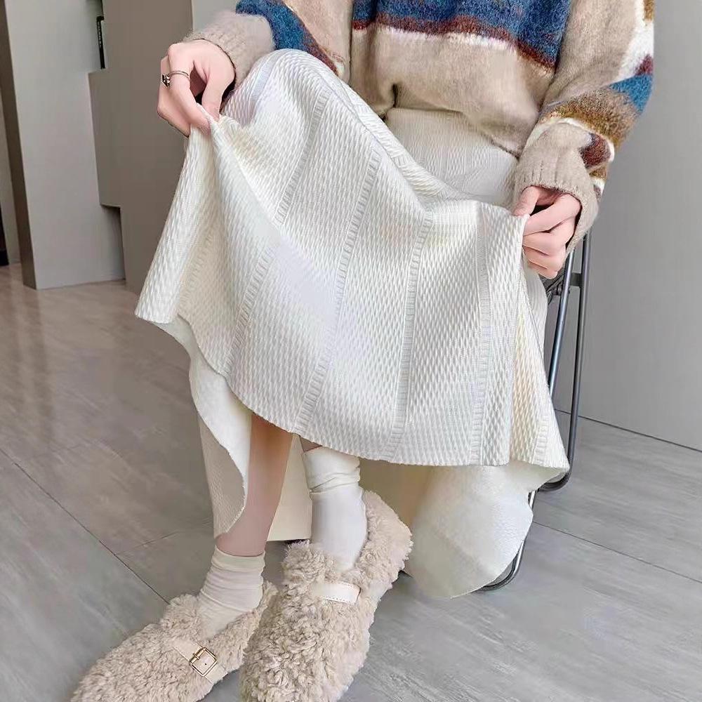 European, American autumn and winter new solid color elastic waist design sense texture medium and long versatile skirt foreign style knitted skirt