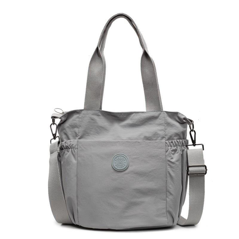 

Casual and simple 2025 spring foreign style bag women s fashion retro niche shoulder bag large capacity commuter tote bag сірий колір