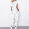 Women Plus Size White Floral Printed Scrub Set Cutout Neck Short Sleeve Pocket Top Long Pants