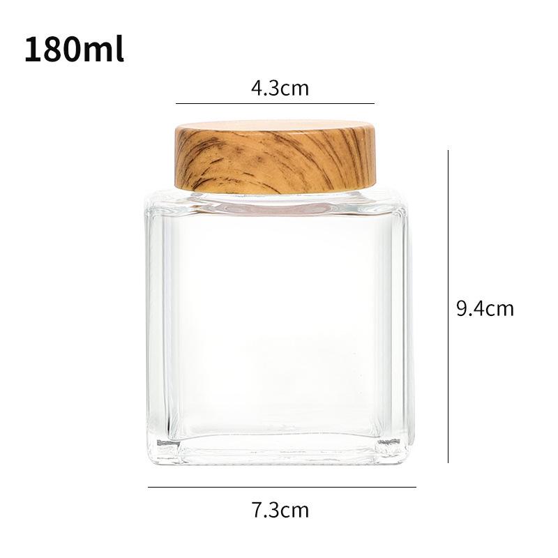 Verdickte flache quadratische Glasflasche mit Holzmaserung für Honig oder Marmelade