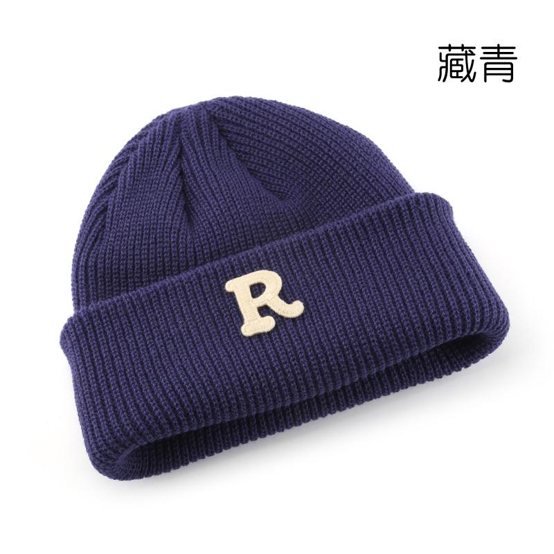 Women's Solid Color Letter Print R Rolled brim knitted hat for outdoor cycling, providing warmth, cold protection, and ear coverage