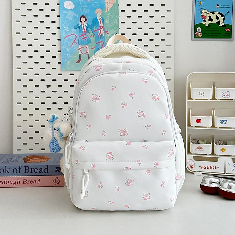 The new schoolbag is high-value, fresh and sweet floral backpack, and the lightweight spring outing backpack for junior high school students.