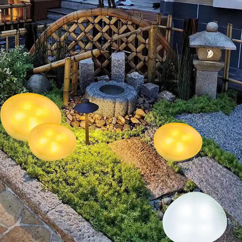 Siebenfarbige Wasserdichte Solarpflasterstein Gartenleuchte: Dekorativer warmer Licht-Simulationsstein für den Außenbereich.