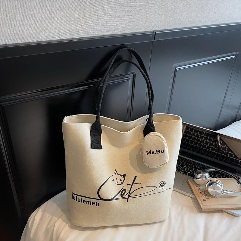 Korean version of simple niche trendy cartoon canvas bag women's autumn new large-capacity commuter portable shoulder tote bag